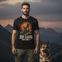 Load image into Gallery viewer, Man wearing a black t-shirt with a graphic and text, standing with a dog against a mountainous background.
