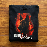 Load image into Gallery viewer, Black hoodie with a german shepherd graphic and 'Control the Chaos' text on a wooden surface