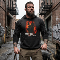 Load image into Gallery viewer, Man wearing a hoodie with a graphic design and text, standing in an urban alleyway.